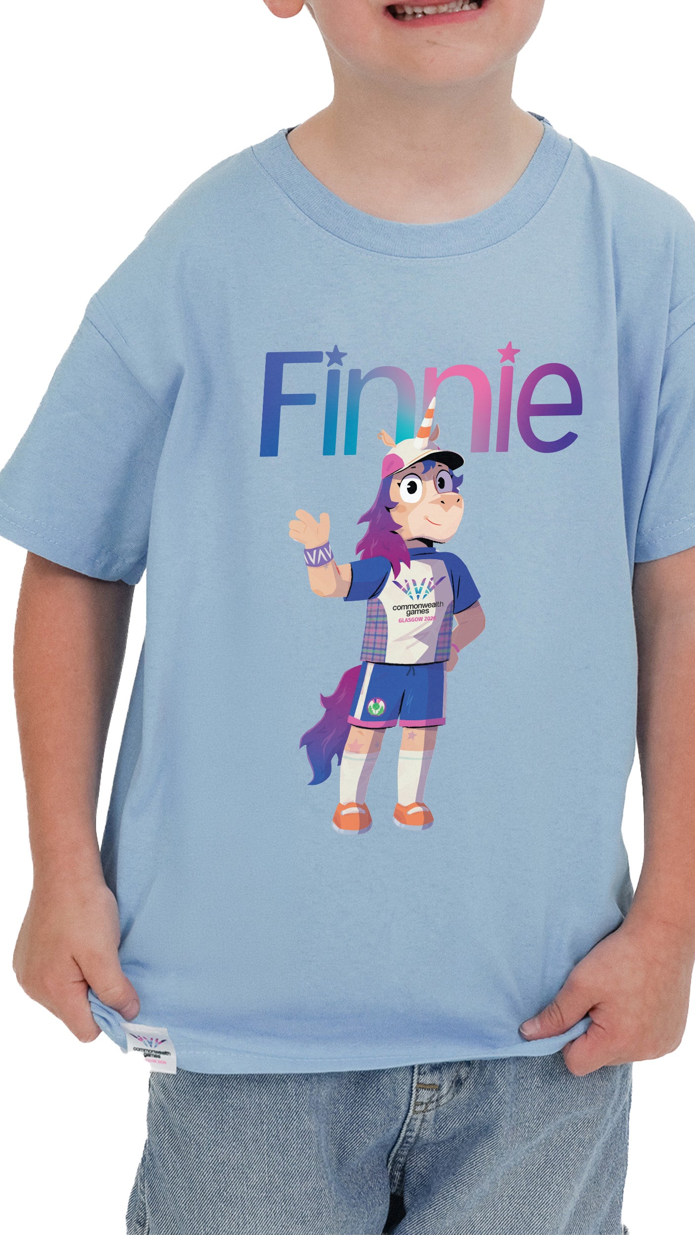 Close up of boy wearing sky blue t-shirt Glasgow 2026 with Glasgow 2026 Finnie mascot design.