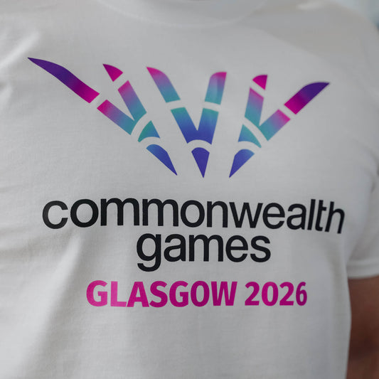 Close up of white Glasgow 2026 logo t-shirt showing chest print.