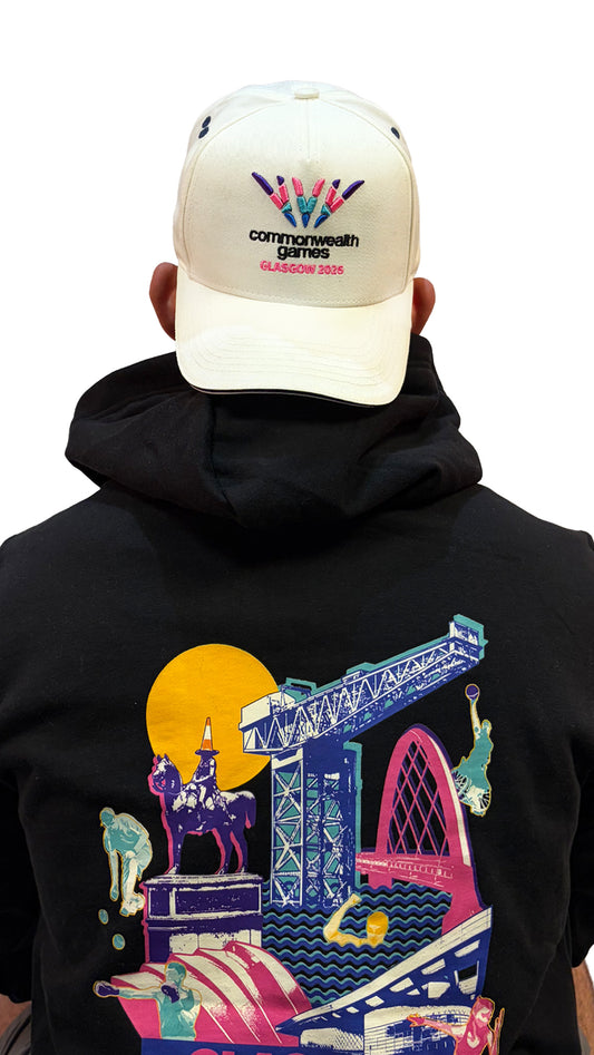 Back view of man wearing reversed natural baseball cap with black sandwich peak and full colour Glasgow 2026 logo.