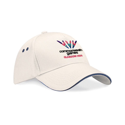 Natural baseball cap with full colour embroidered Glasgow 2026 logo and black sandwich peak
