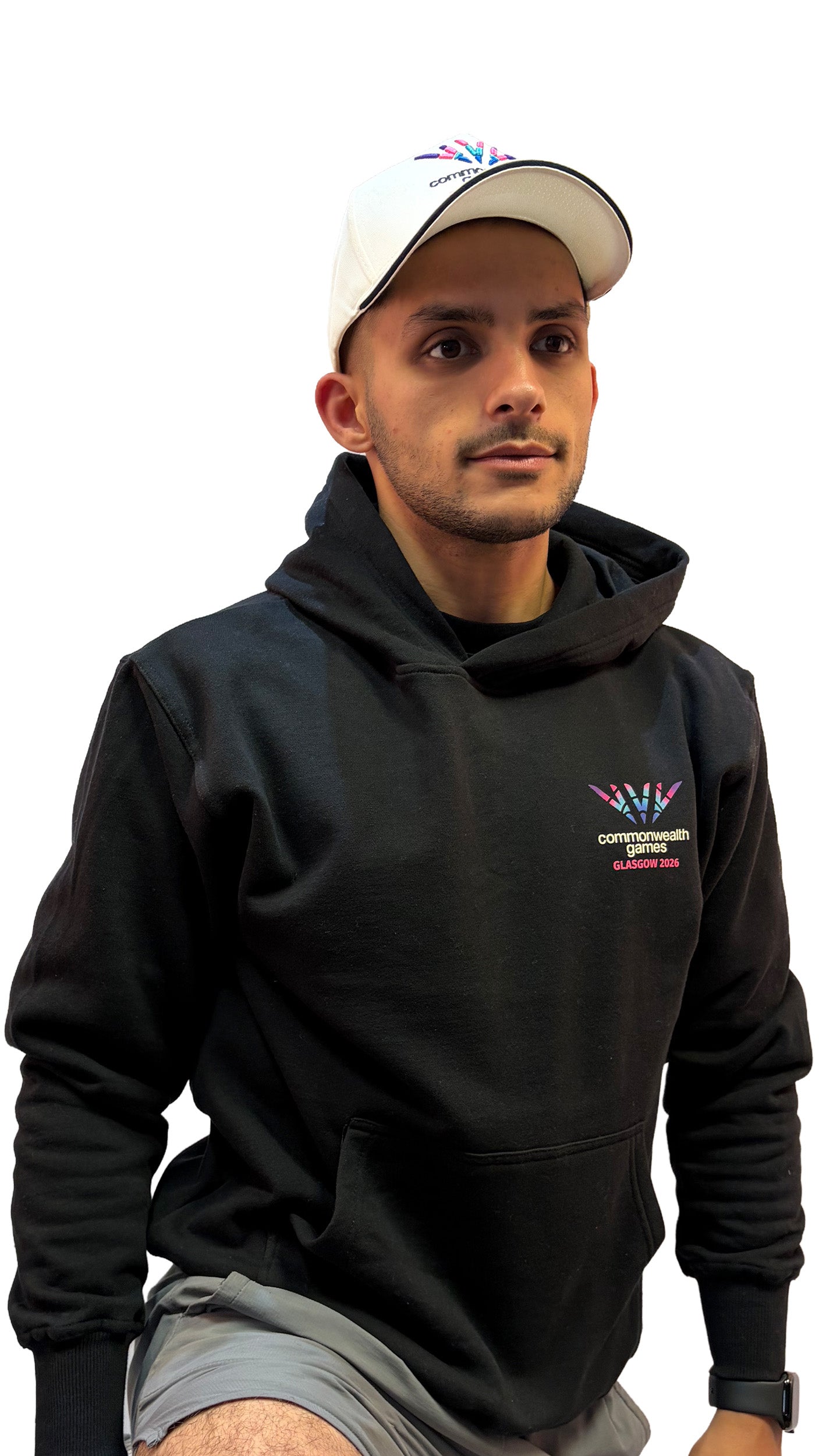 Front view of man wearing natural baseball cap with black sandwich peak and full colour Glasgow 2026 logo.