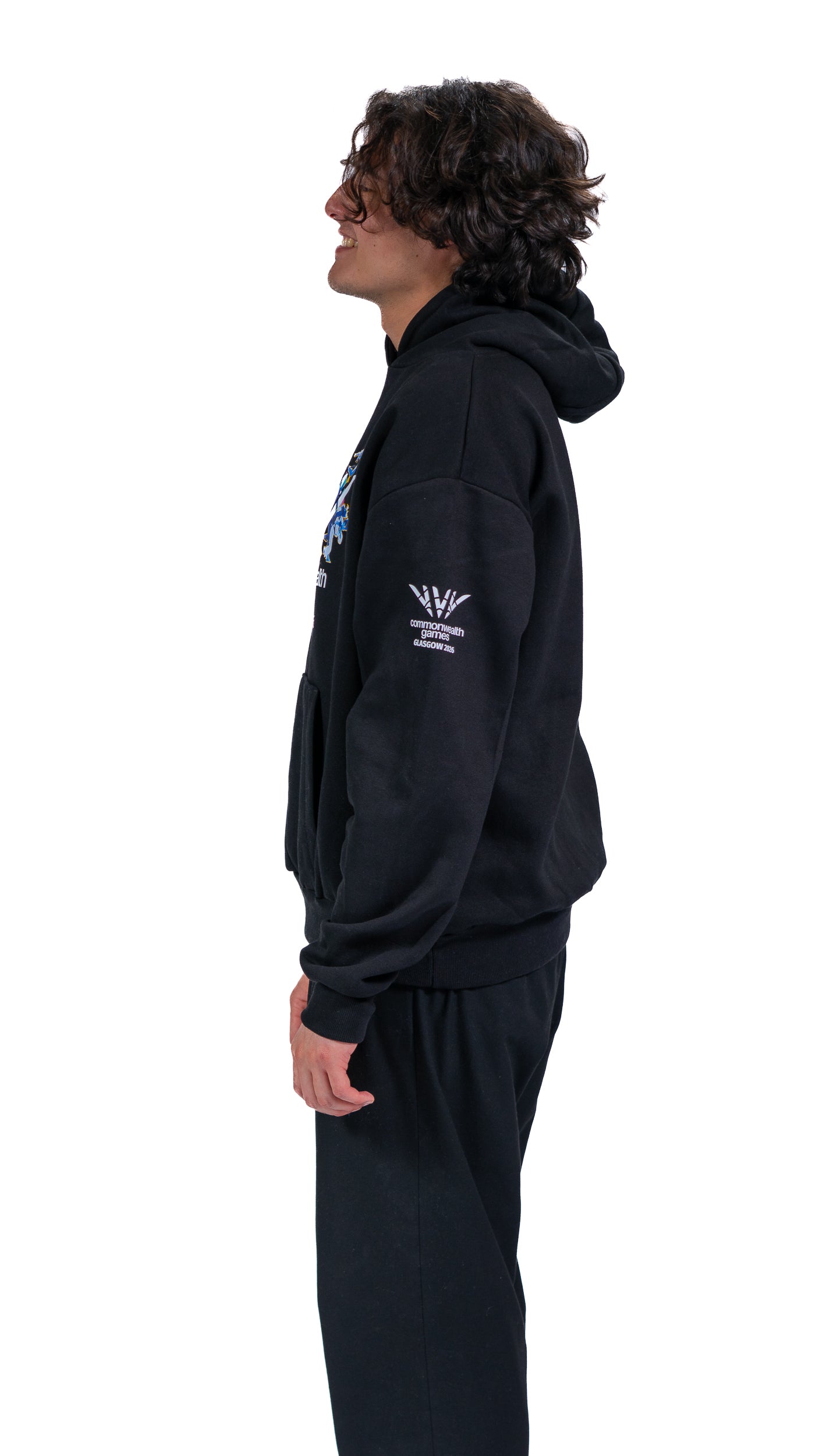 Side view of man wearing navy Glasgow 2026 Celebration graphic hoodie.