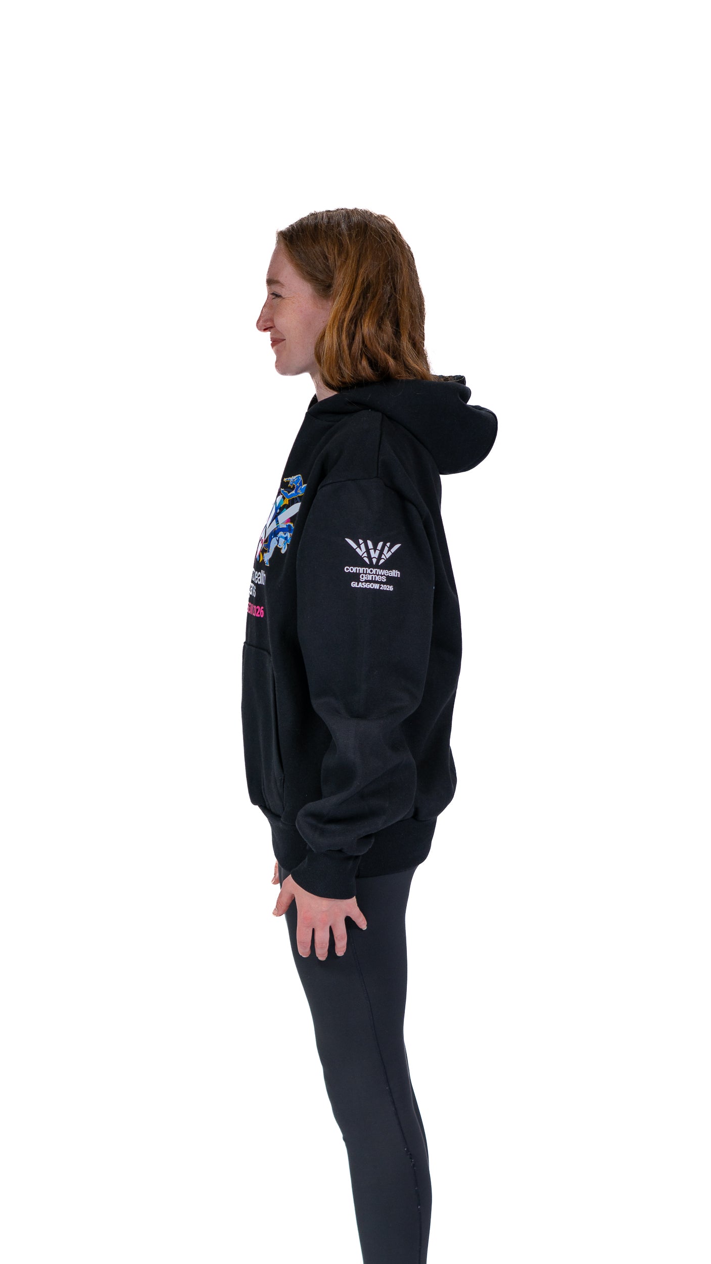 Side view of woman wearing navy Glasgow 2026 Celebration graphic hoodie.