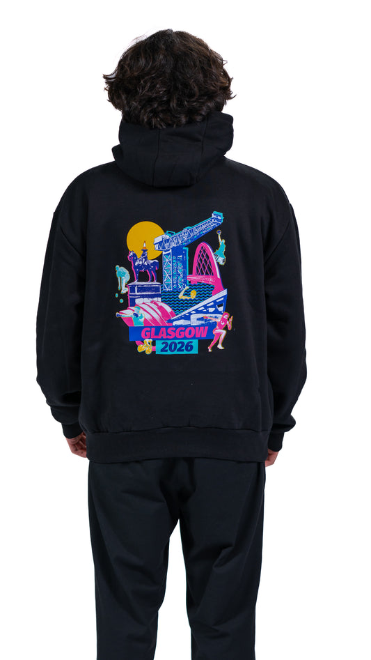 Back view of man wearing black hoodie with Glasgow 2026 Cityscape graphic.