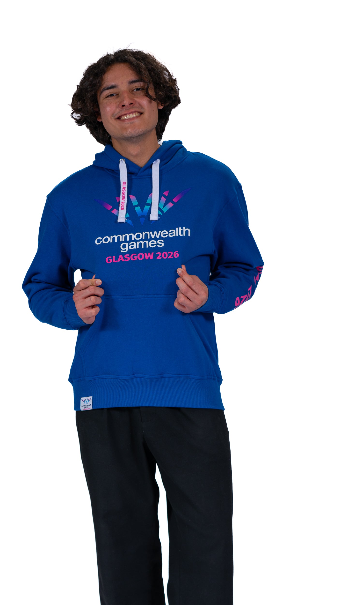 Man wearing unisex, denim hoodie with full colour Glasgow 2026 logo on the front and Glasgow 2026 on the sleeve.
