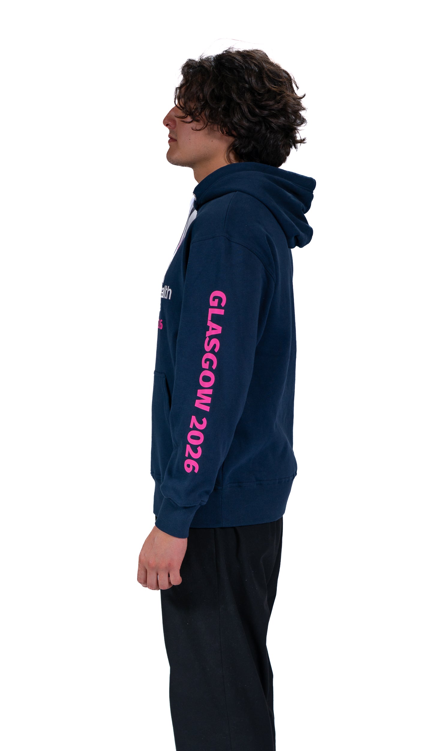 Side view of man wearing unisex, navy hoodie showing Glasgow 2026 on the sleeve.