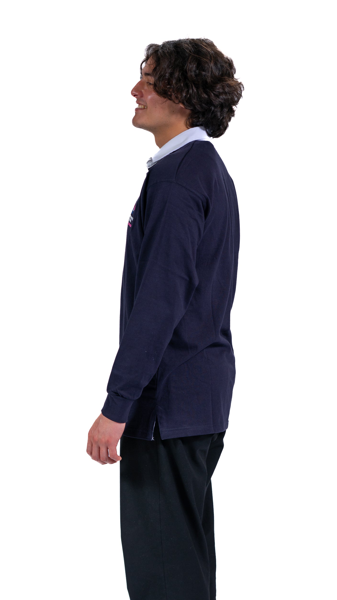 Side view of man wearing navy Glasgow 2026 logo rugby top with white collar.