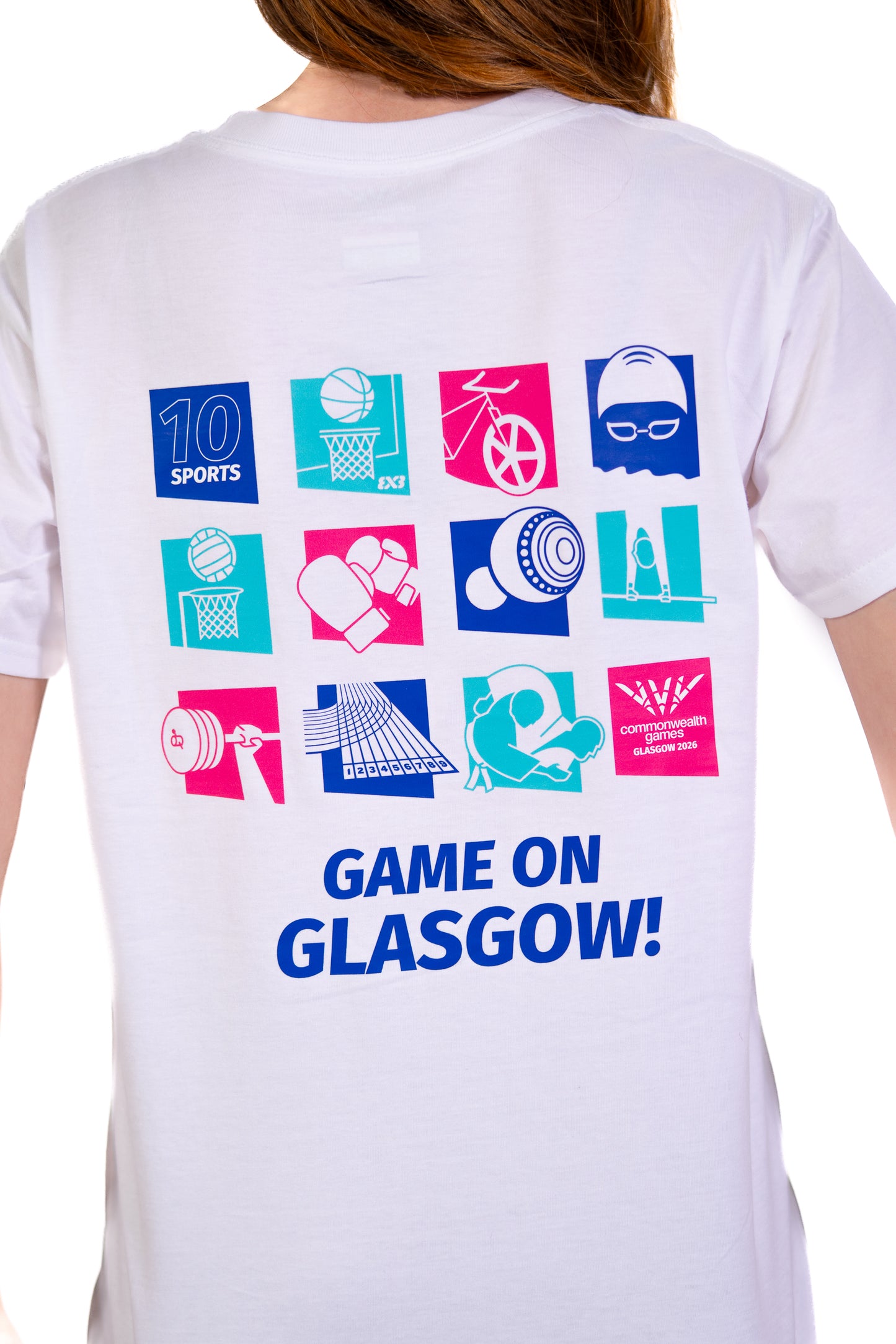 Back view of woman wearing white pictogram t-shirt showing close-up of Glasgow 2026 pictograms for each sport on the back.