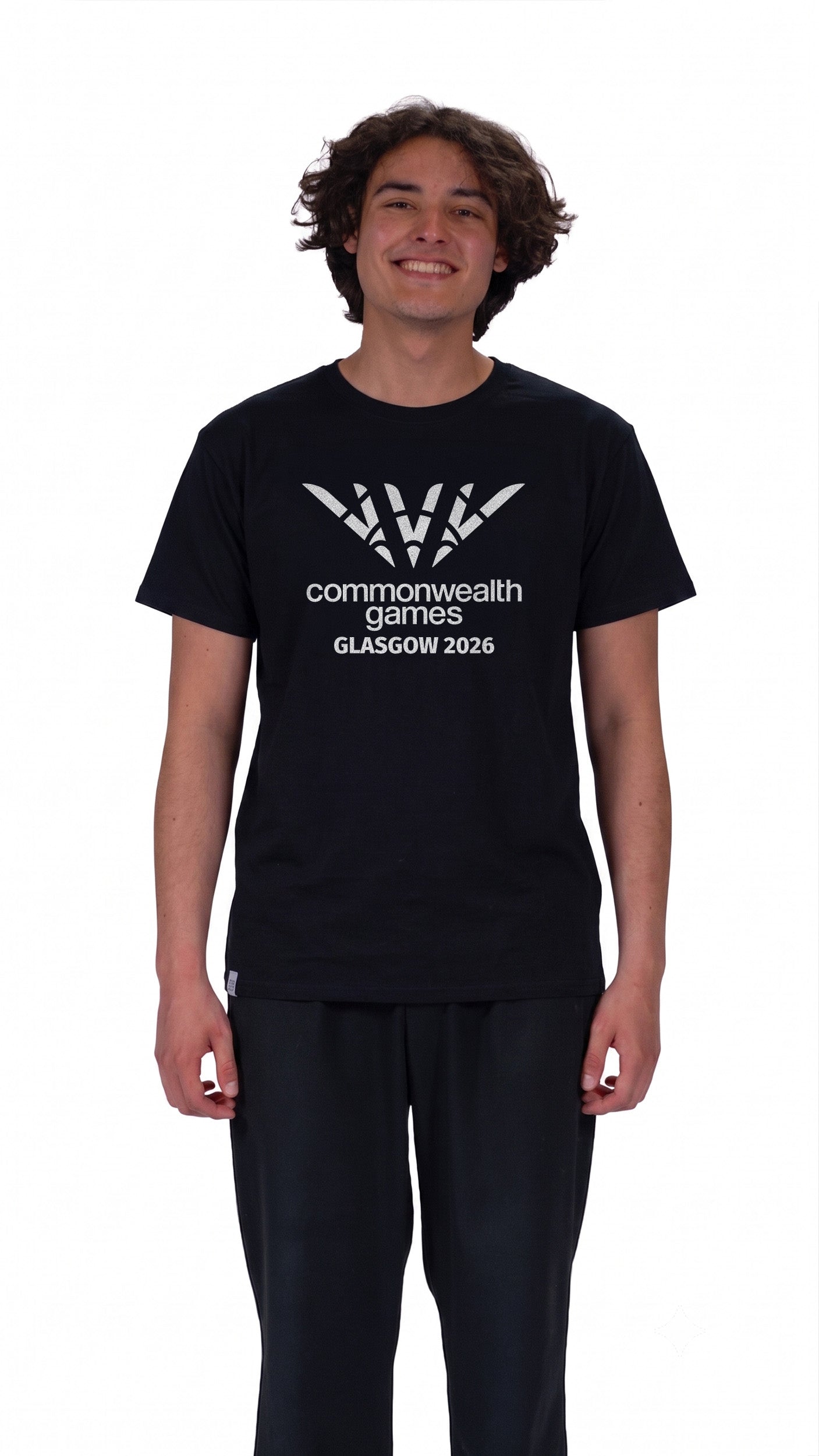 Front view of man wearing black pictogram t-shirt showing full colour Glasgow 2026 logo on the front.