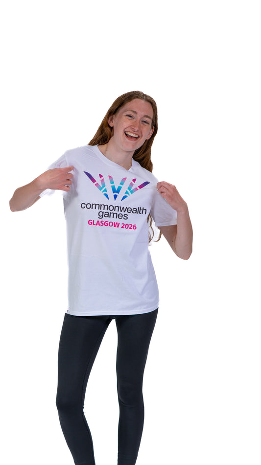 Front view of woman wearing white pictogram t-shirt showing full colour Glasgow 2026 logo on the front.