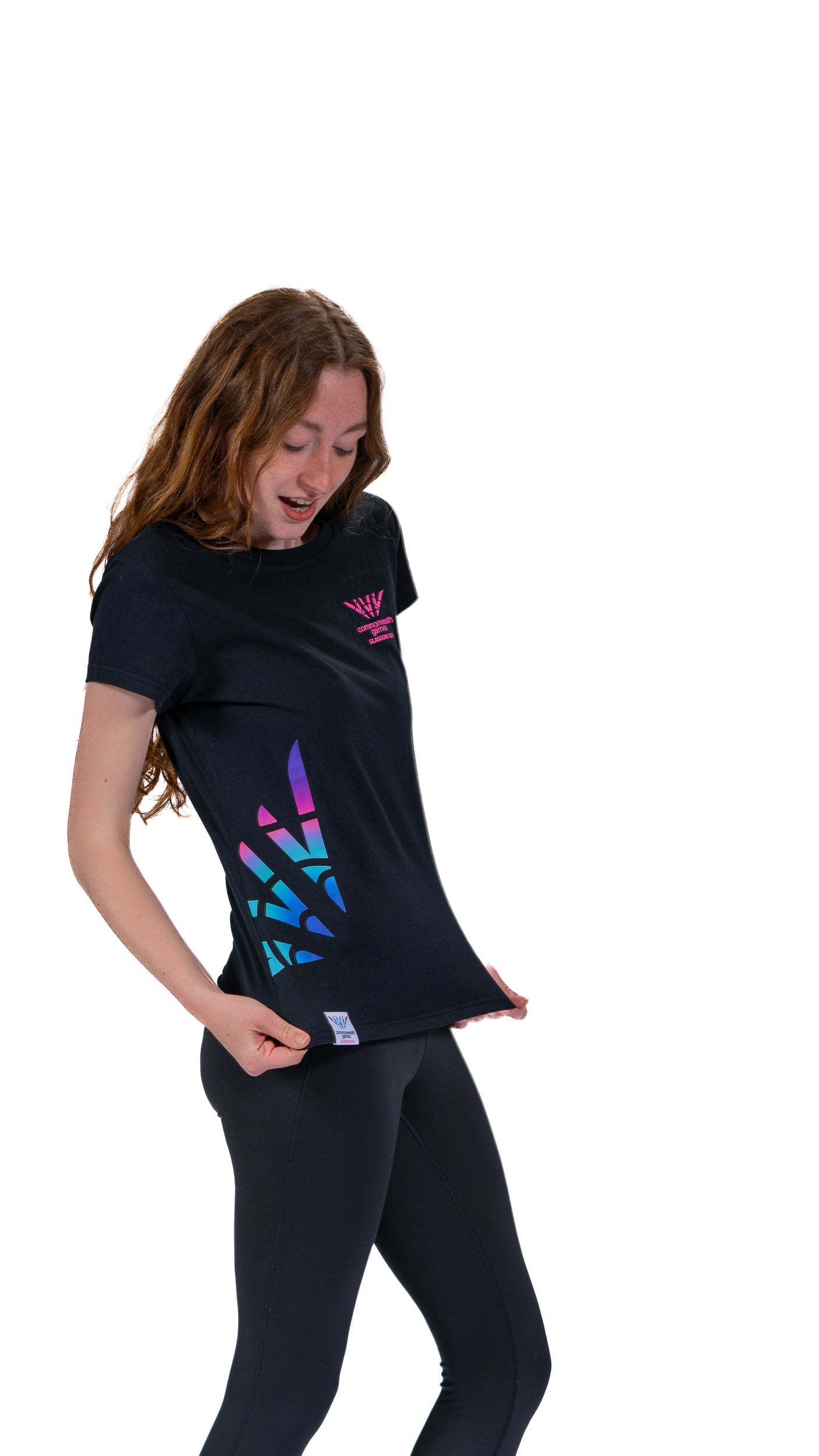Side view of woman wearing black fitted t-shirt with Glasgow 2026 logo chest print and Celebration mark side print.