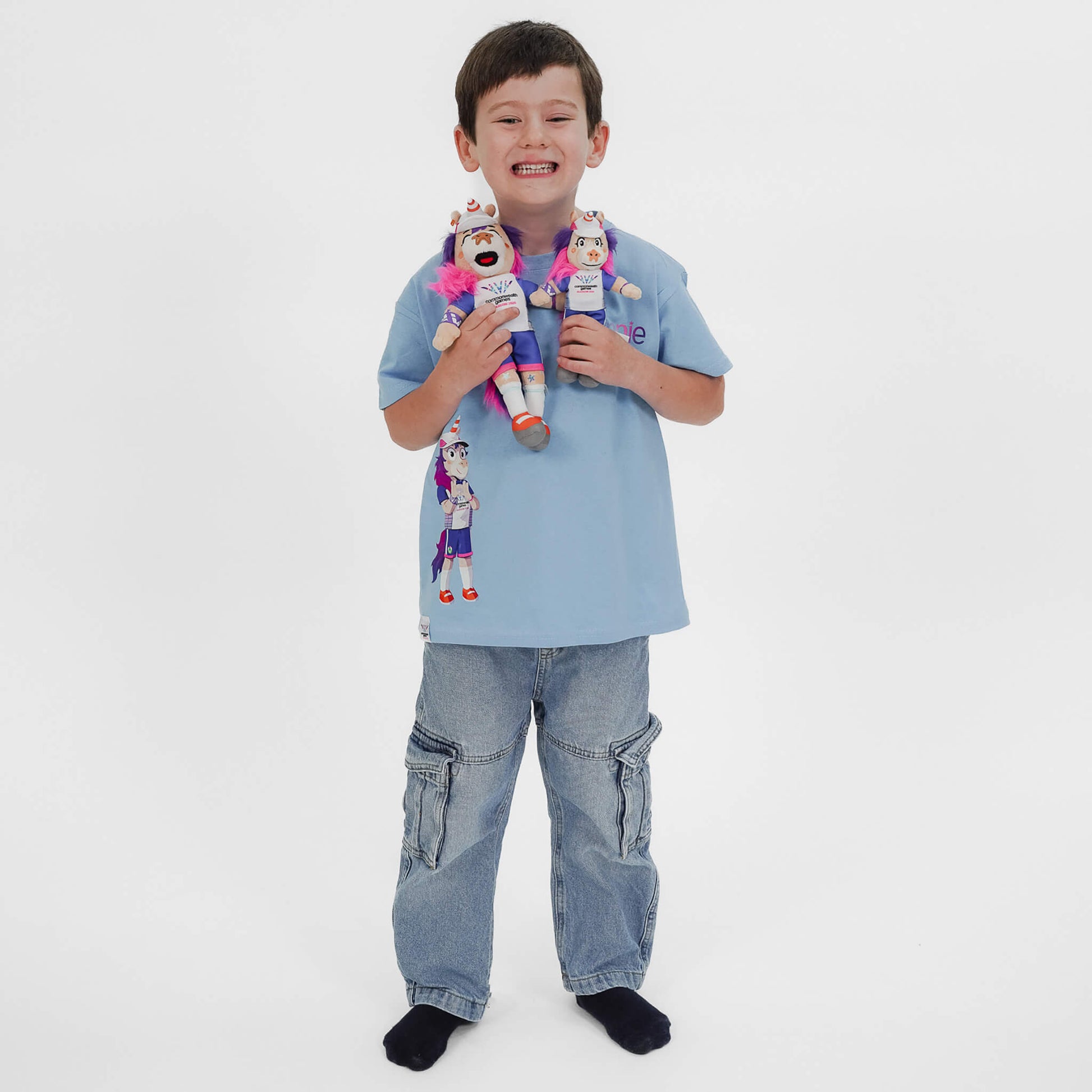 Boy holding both of our Glasgow 2026 Finnie Mascots - 15cm & 25cm