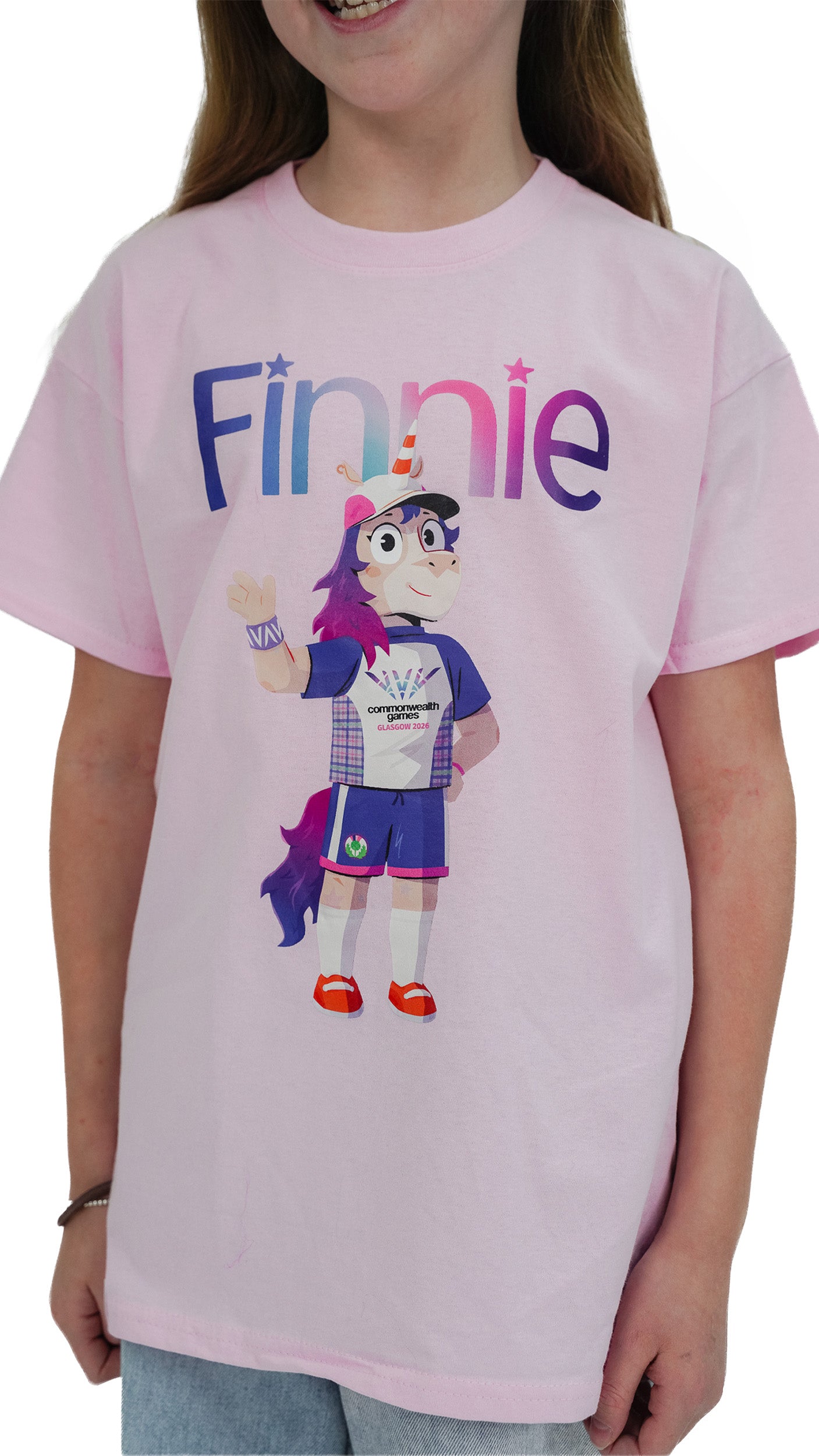 Close up of girl wearing pink t-shirt  Glasgow 2026 with Glasgow 2026 Finnie mascot design.