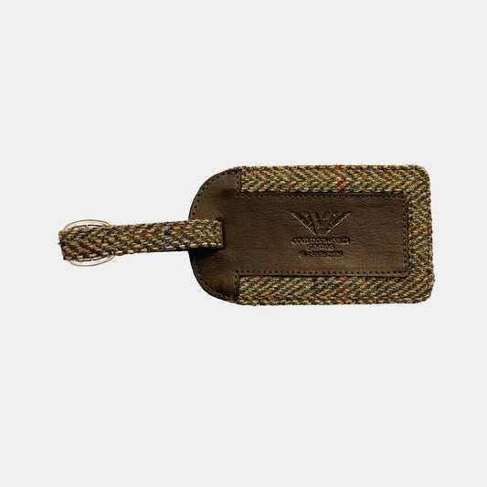 Front view of Glasgow 2026 Country Green Harris Tweed Luggage Tag on grey background 