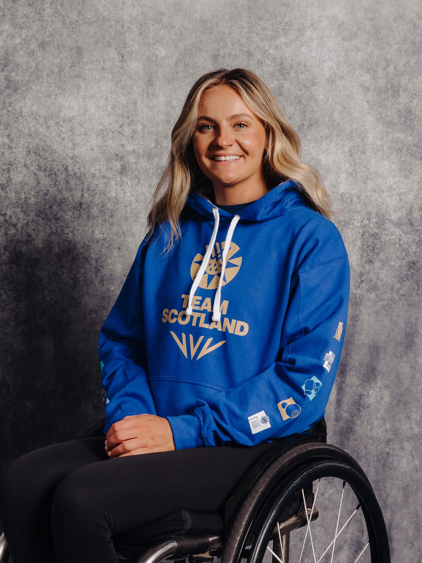 3/4 View Royal Blue G2026 x Team Scotland Contrast Hoodie worn by athlete Melanie Woods